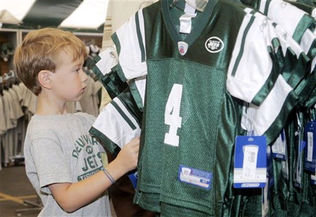A young fan looks at a new Favre jersey.
